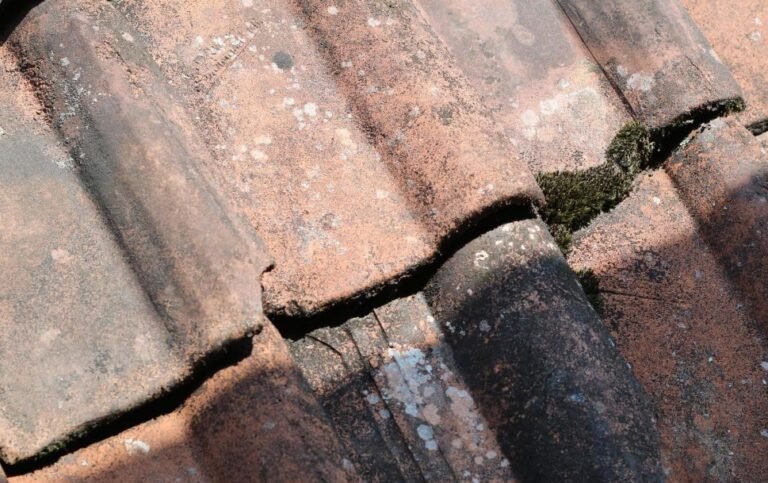 Tiled roof worn and needing to have roof replacement or roof restore